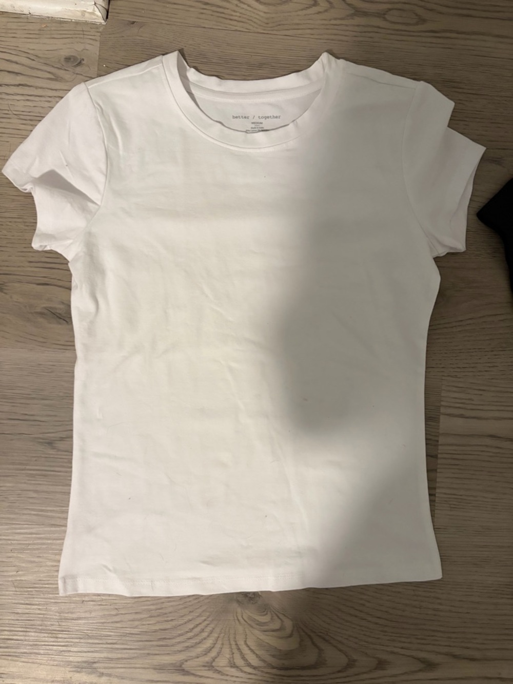 Two brand new T-shirts, black and white sold together.